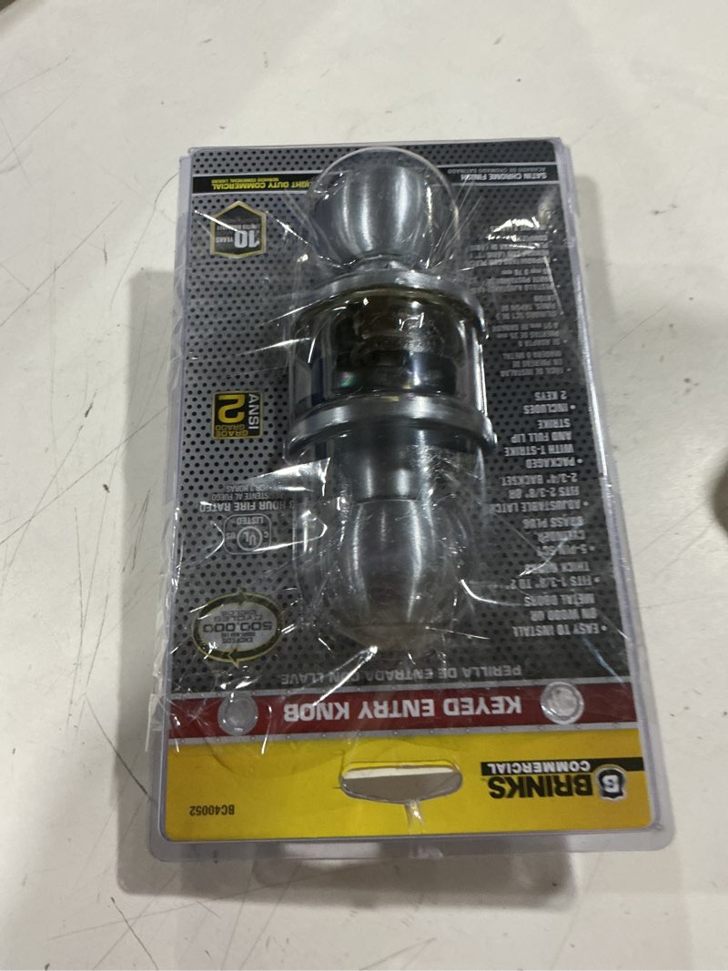 Condition photo showing As Is for brinks commercial satin chrome interior/exterior keyed entry door knob