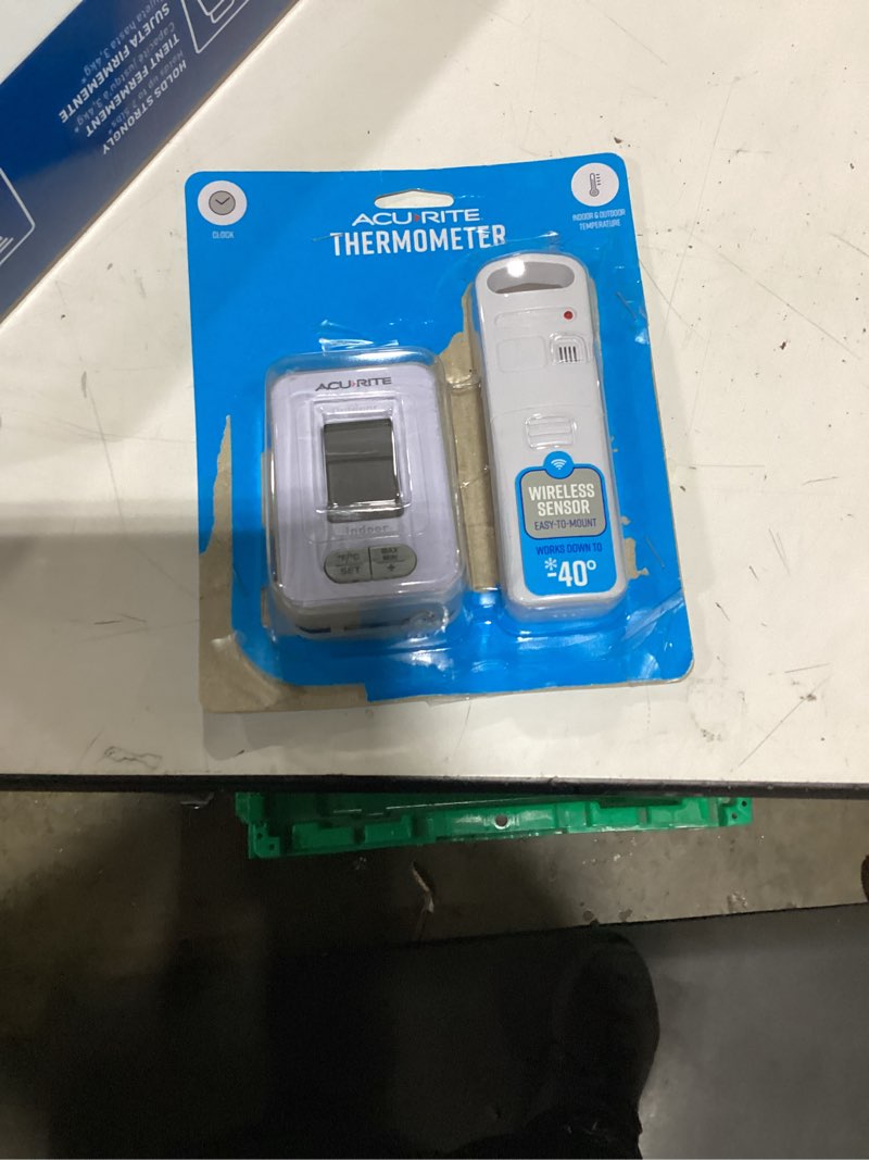 Condition photo showing New/Like New for acurite battery-powered indoor/outdoor digital thermometer with clock, white, 3.5" h x 2.3" w x 1.2" d