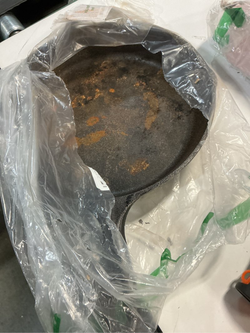 Condition photo showing As Is for Lodge 10.25 Inch Cast Iron Skillet – Pre-Seasoned Frying Pan with Teardrop Handle – Oven, Stovetop, Grill & Campfire Use – Made in USA – Durable, Non-Toxic, Even-Heating Cookware – Black 10.25 Inch (1 Count)