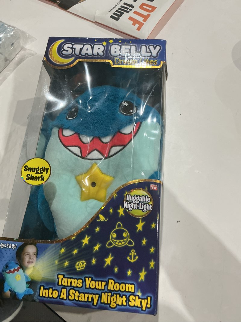 Condition photo showing New/Like New for Ontel Star Belly Dream Lites, Stuffed Animal Night Light, Snuggly Blue Shark - Projects Glowing Stars & Shapes in 6 Gentle Colors, As Seen on TV