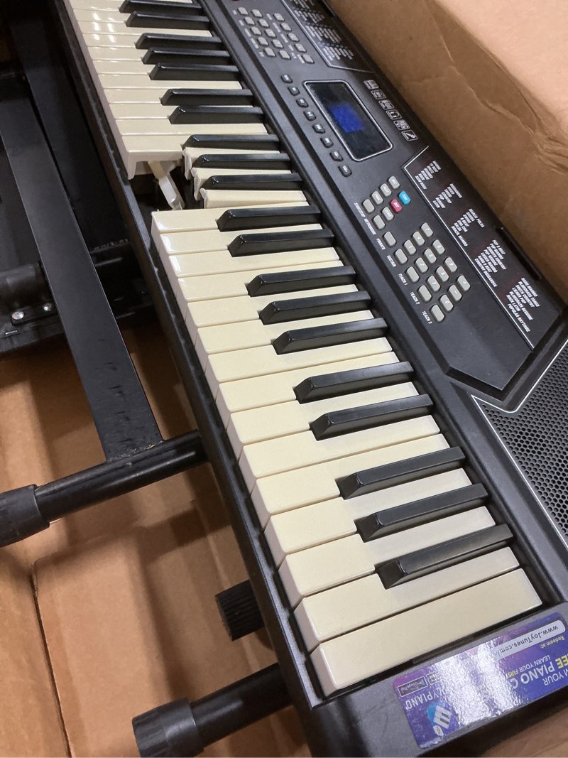 Condition photo showing As Is for rockjam 61 key keyboard piano stand with pitch bend kit, piano bench, headphones, simply piano app & keynote stickers 61 key kit with pitch bend