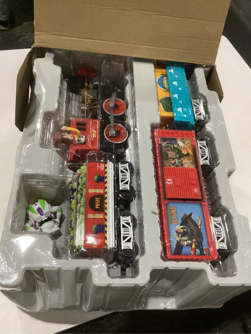 Condition photo showing New/Like New for Lionel Battery-Operated Disney Toy Story Toy Train Set with Locomotive, Train Cars, Track & Remote with Authentic Train Sounds, & Lights for Kids 4+ Ready-to-Play