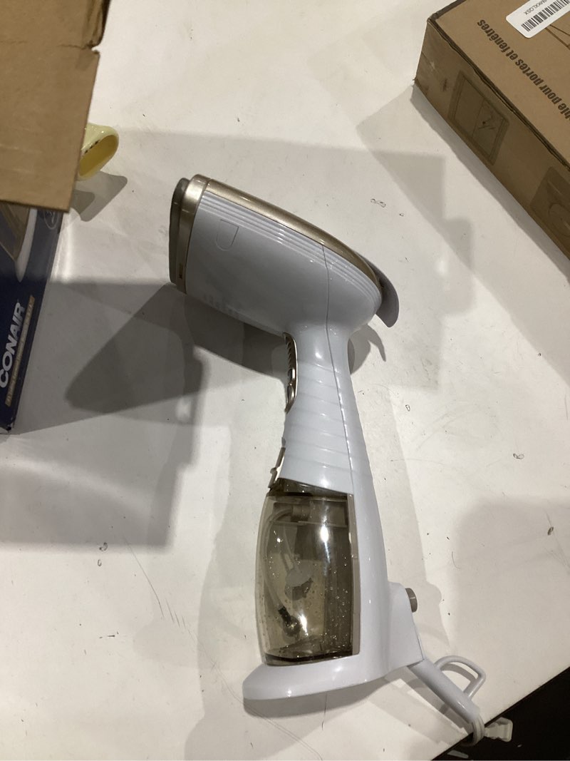 Condition photo showing As Is for shipping.  conair handheld garment steamer for clothes, turbo extremesteam 1875w fabric steamer, portable handheld design, strong penetrating steam, white/champagne