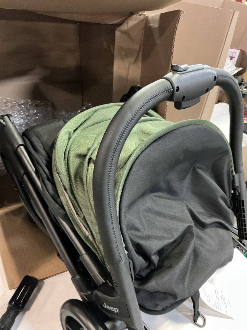 Condition photo showing Good Condition for jeep powerglyde stroller by delta children lightweight travel stroller with smoothest ride & compact fold, 3-position recline, extra large storage basket, olive green(similar )