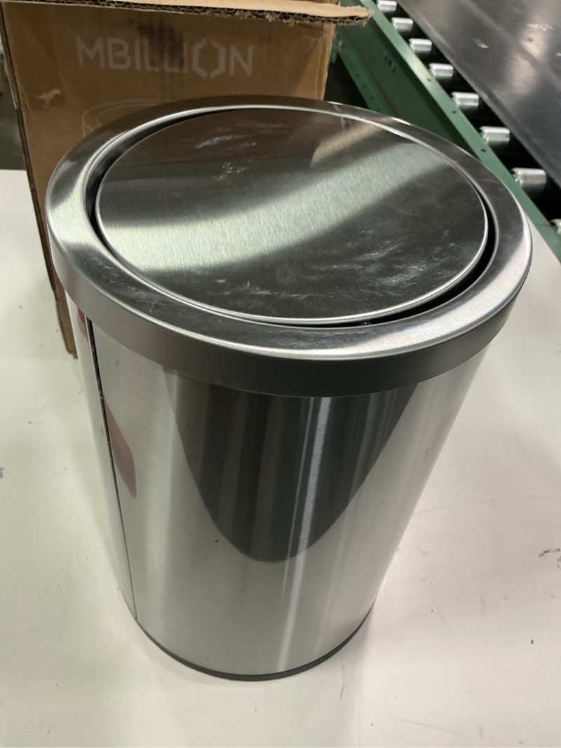 Condition photo showing Good Condition for Mbillion Small Trash Can with Swing Lid 2.4 Gallons/9 Liter, Mini Trash Can with lid, Stainless Steel Cylindrical Garbage Can for Home and Office, for Ground and Desktop(Brushed Silver) Brushed Silver 9L 9 Liter