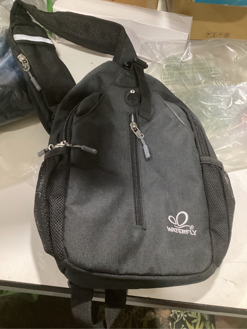 Condition photo showing Good Condition for waterfly crossbody sling backpack sling bag travel hiking chest bag daypack (black) black small