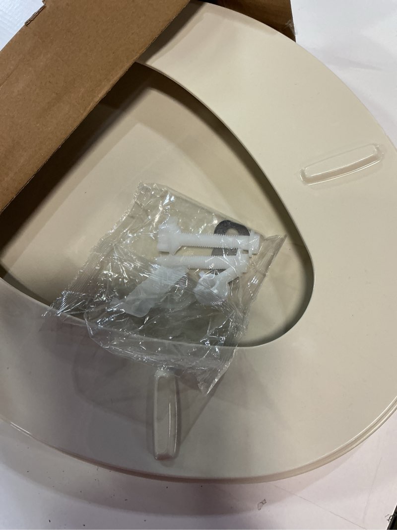 Condition photo showing As Is for gerber elongated toilet seat with cover, soft close, no slam, quick & easy install, heavy-duty plastic, adjustable fit for standard elongated toilets, durable & fade-resistant, bone g009921325