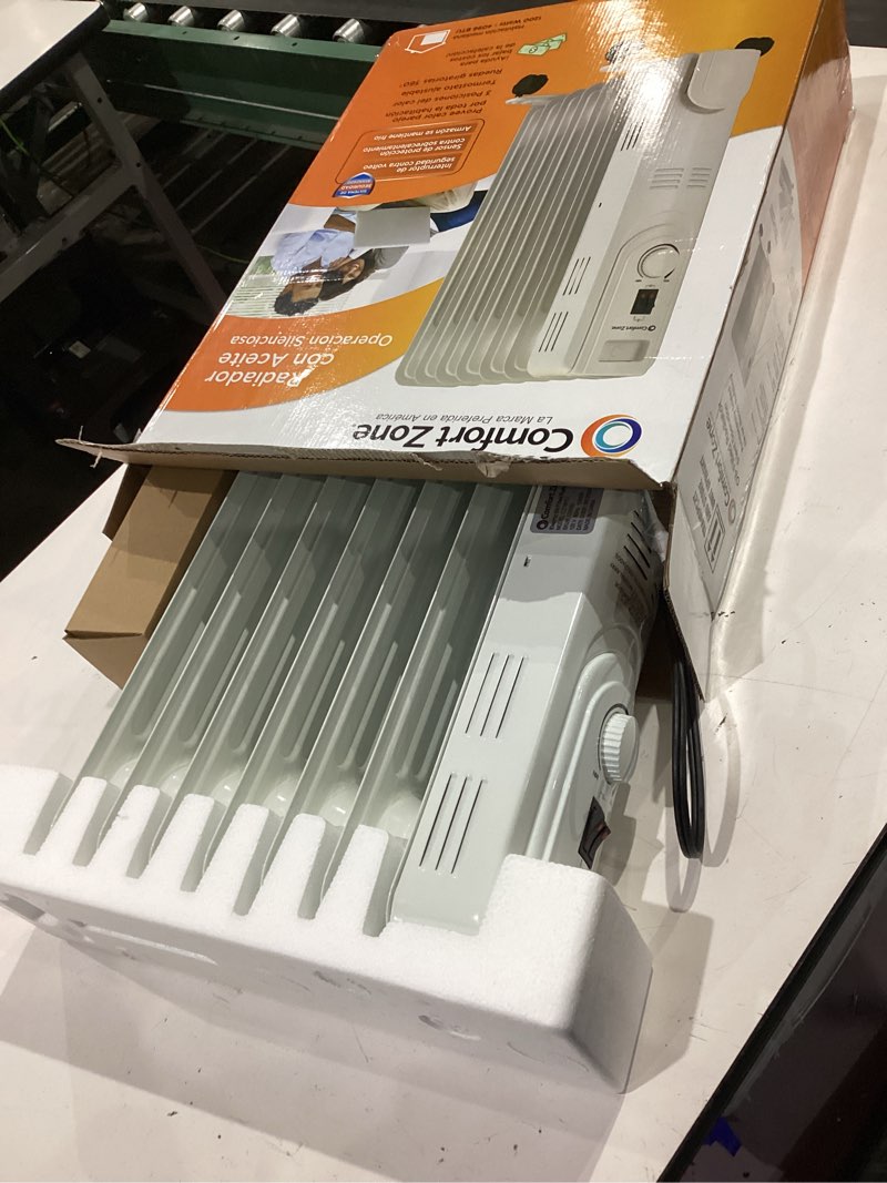 Condition photo showing New/Like New for comfort zone electric oil-filled radiant radiator space heater, never refill, adjustable thermostat, tip-over switch & overheat protection system, ideal for home, bedroom, & office, 1,200w, cz7007j