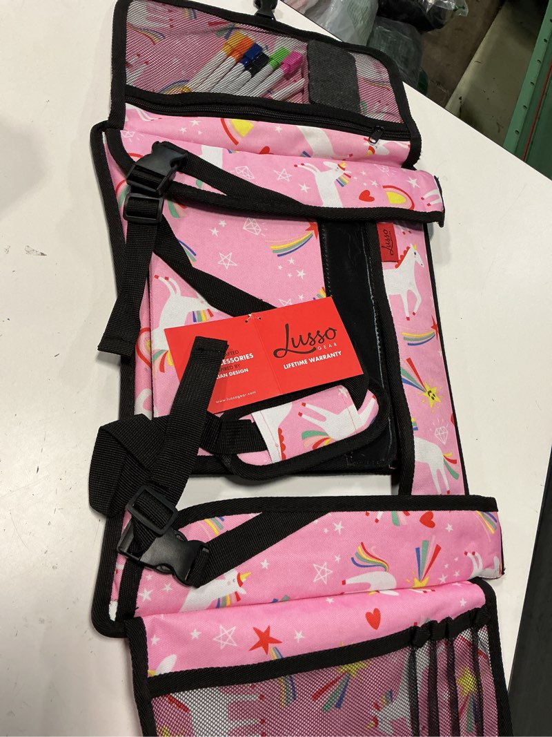Condition photo showing Good Condition for lusso gear travel car seat tray - dry erase board & secure tablet holder for toddler travel - durable 600d oxford cloth with snack & toy compartments for road trip essentials for kids - pink unicorn - pink unicorns