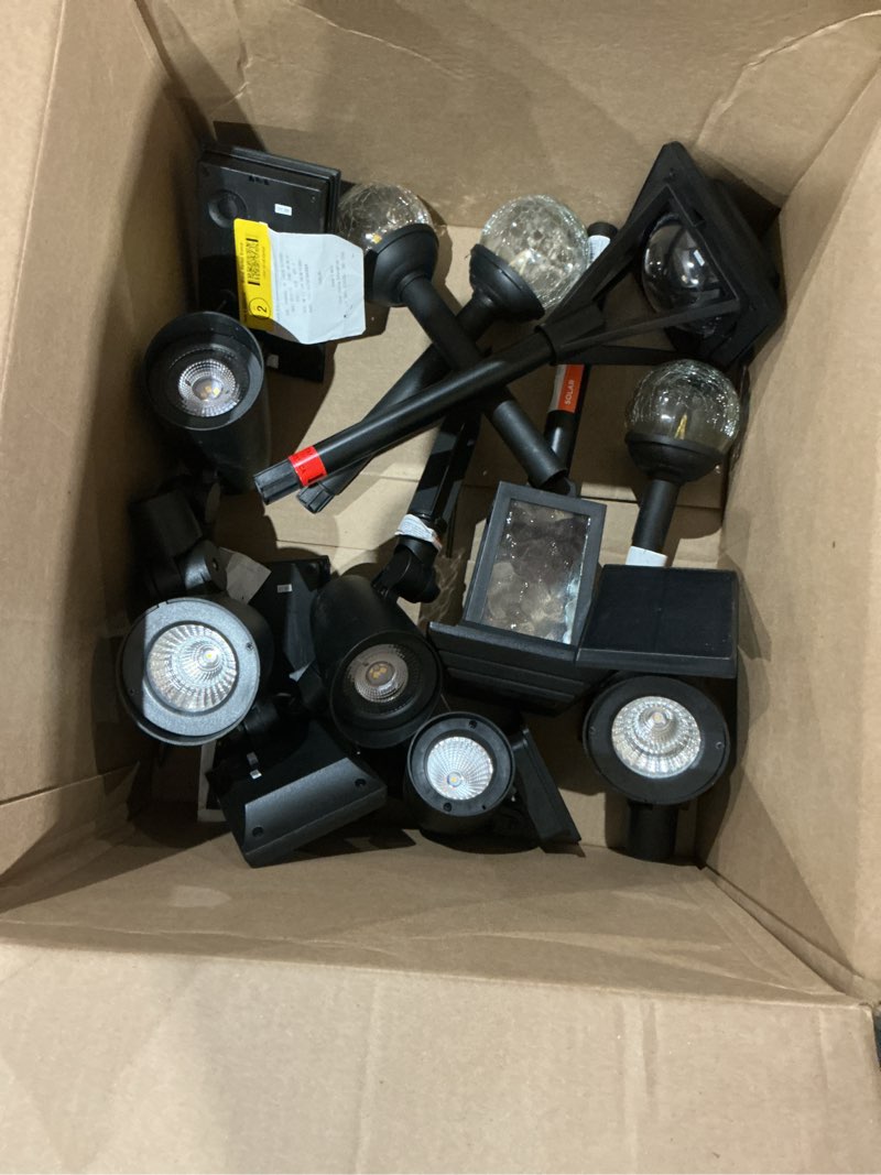 Condition photo showing As Is for assorted of solar garden lights