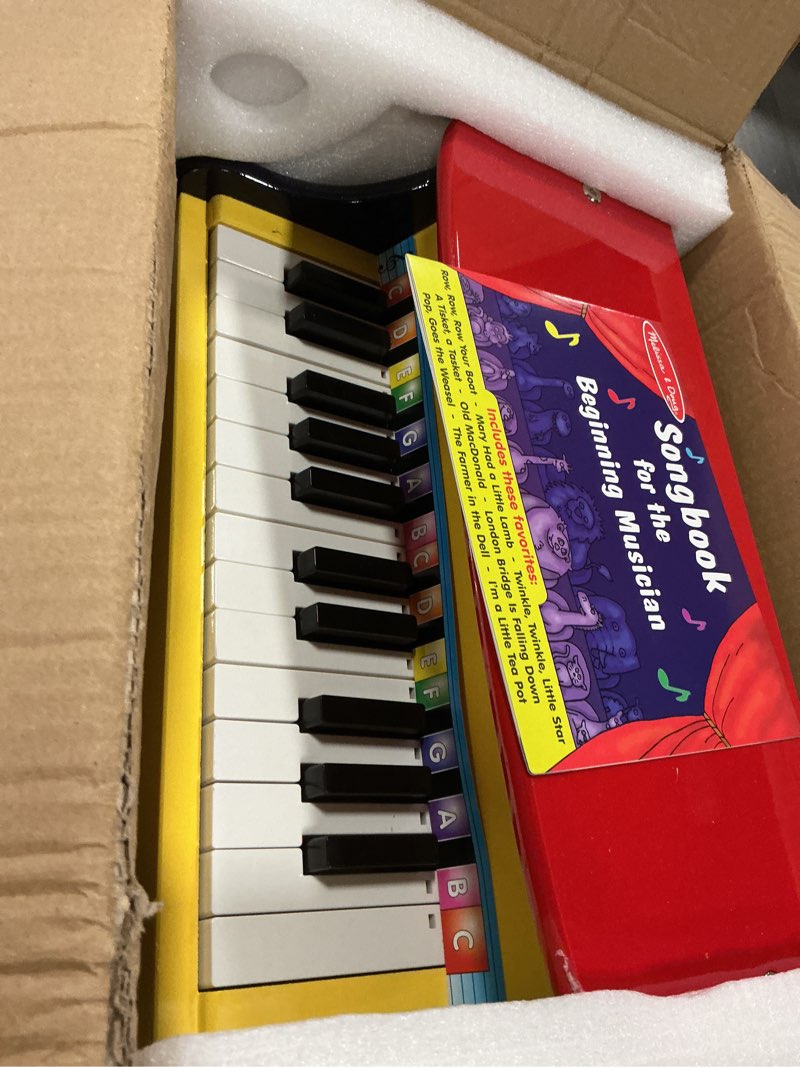 Condition photo showing New/Like New for Melissa & Doug Learn-to-Play Piano with 25 Keys and Color-Coded Songbook Toy Piano Kids, Toddler Toy