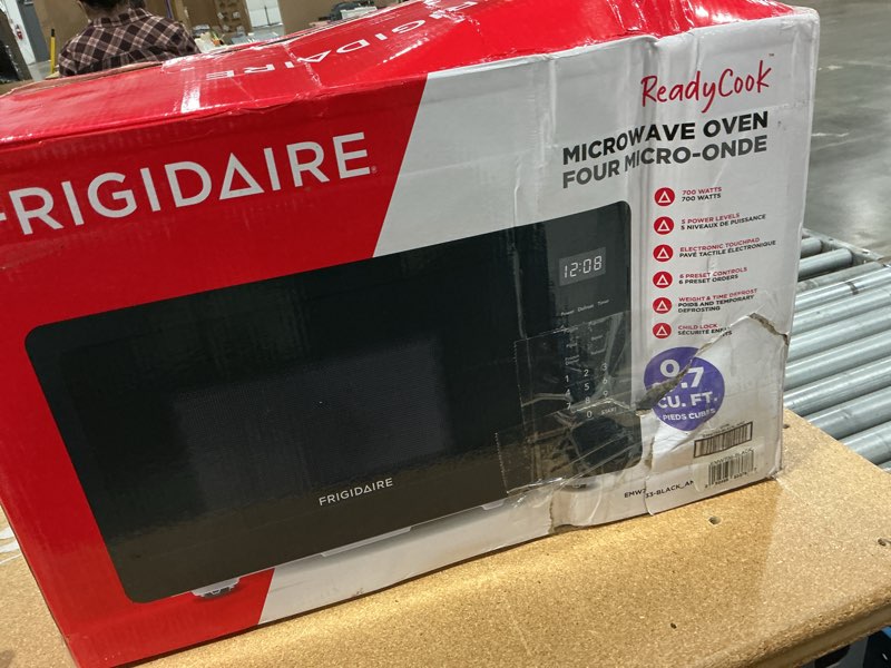 Condition photo showing New/Like New for frigidaire emw736blk 0.7 cu. ft. microwave, black