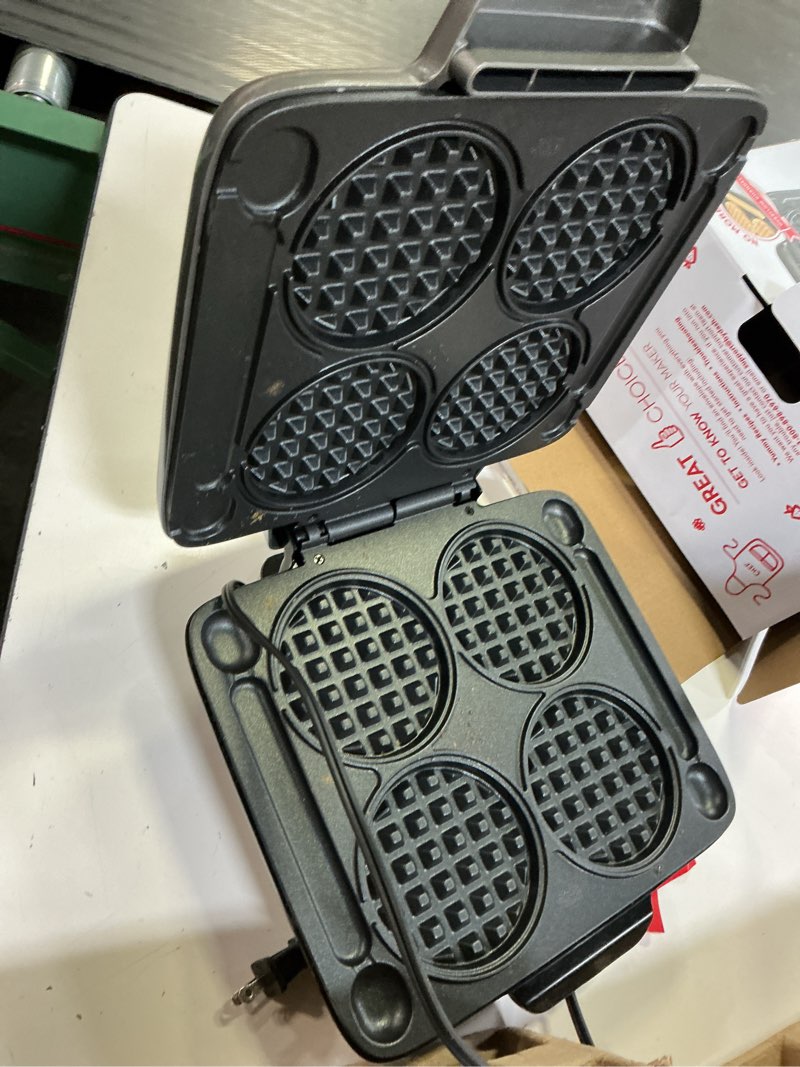 Condition photo showing As Is for dash multi mini waffle maker - makes four waffles at once for family breakfasts - dual nonstick heating plates & easy-release surface - compact & fast-heating - graphite