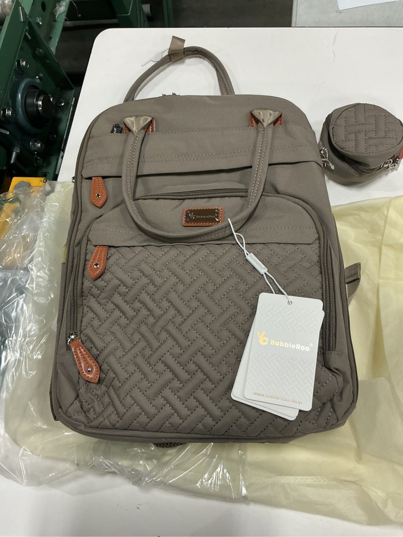 Condition photo showing New/Like New for babbleroo diaper bag backpack - baby essentials travel tote - multi function water resistant diaper bag, travel essentials baby bag with changing pad, stroller straps & pacifier case - unisex, khaki large khaki