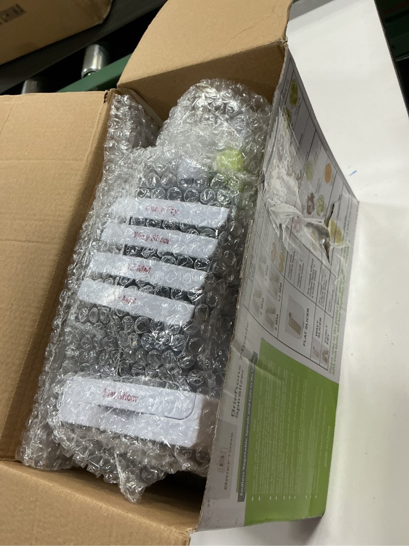 Condition photo showing New/Like New for brieftons 7-blade vegetable spiralizer: zucchini spiral slicer & veggie noodle maker, japanese steel blades, catch container, strong suction cup, blade caddy, 4 ebooks | low carb, vegan, gluten-free white ( 7 blades )