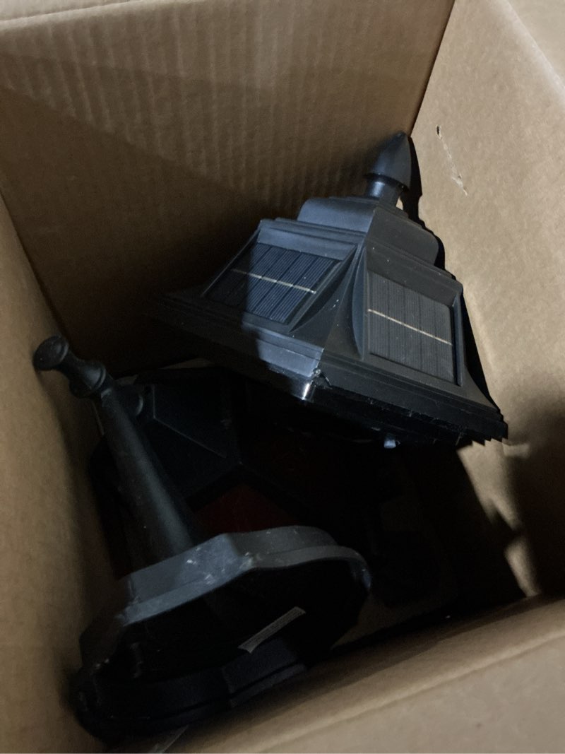 Condition photo showing As Is for allen + roth st. sean 1-light 11.25-in h matte black dusk to dawn led, outdoor wall light