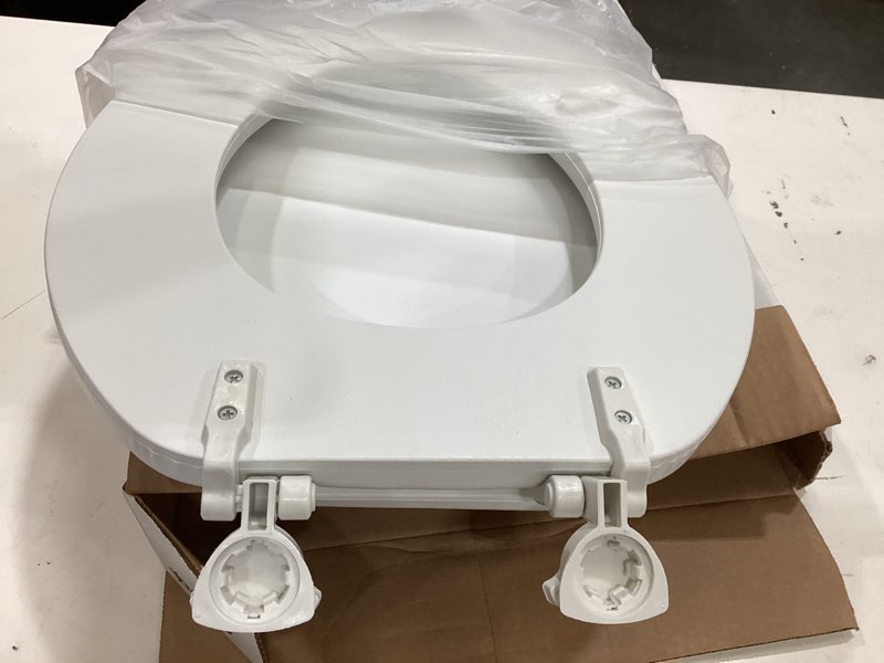 Condition photo showing As Is for mayfair by bemis eden cushioned vinyl white round padded toilet seat