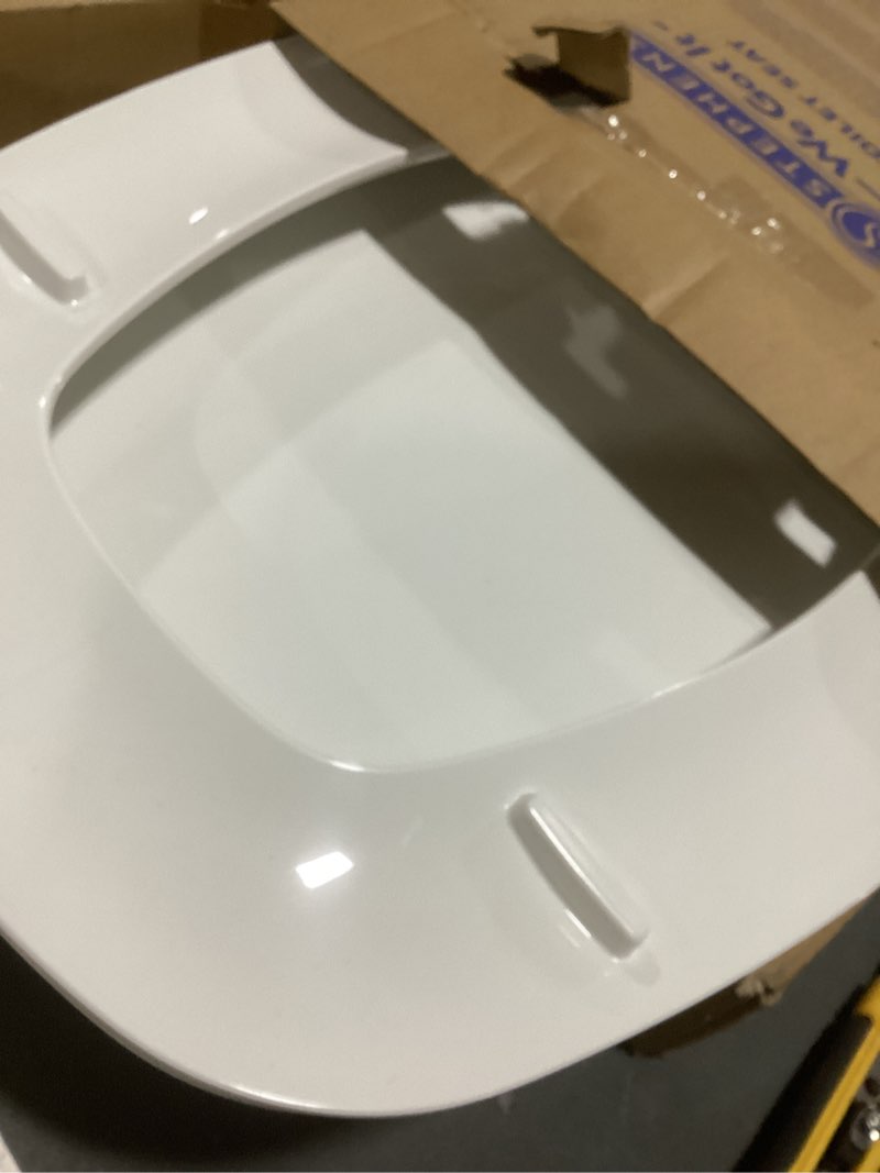 Condition photo showing As Is for jones stephens c1050s00 white deluxe plastic toilet seat, square closed front with cover to fit eljer emblem, slow-close, elongated white