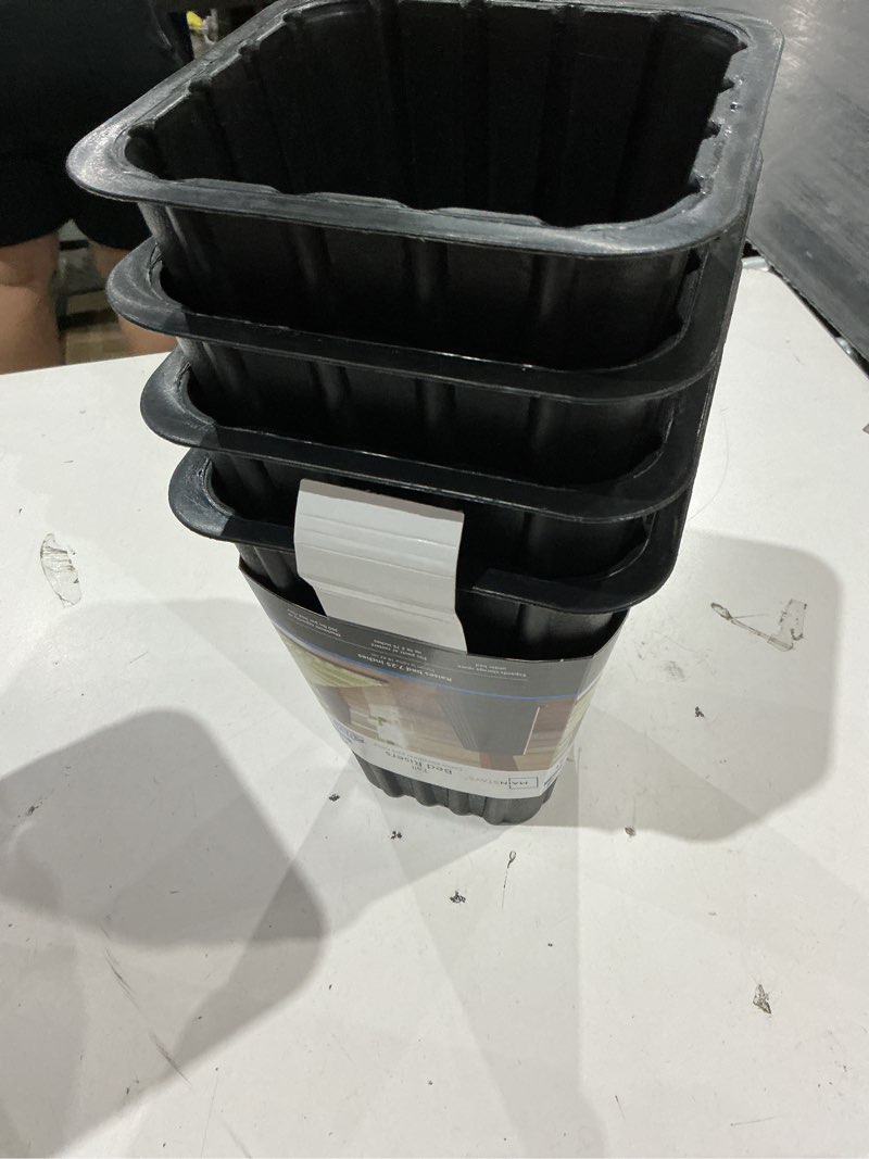 Condition photo showing As Is for mainstays black plastic tall bed risers to raise your bed for storage, 4-pack, 6.75 in x 6.75 in x 8 in