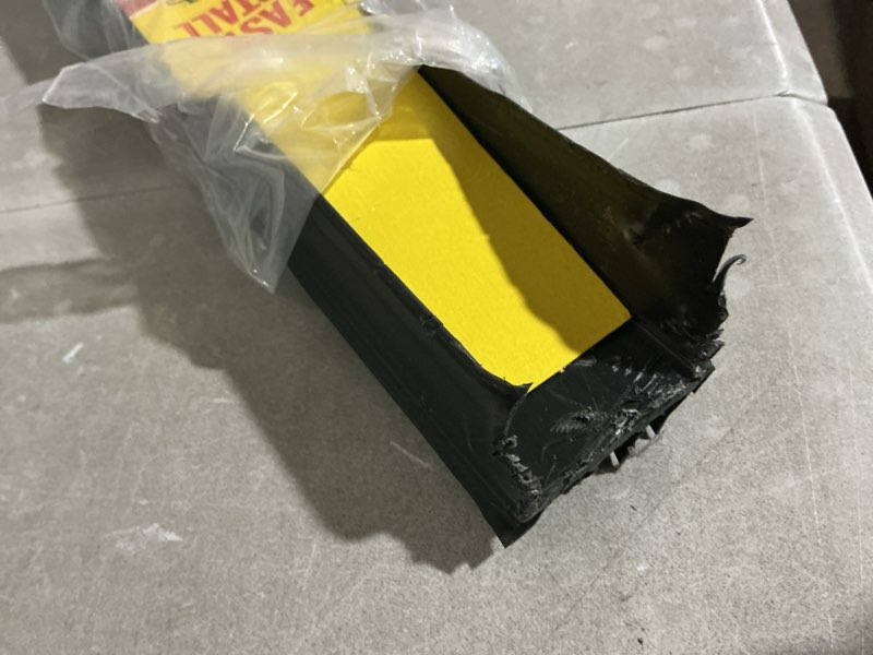 Condition photo showing As Is for m-d building products 43339 36 in. black vinyl cinch® u-shape slide-on under door seal