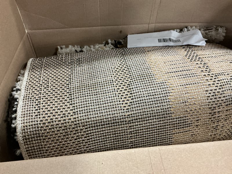 Condition photo showing As Is for jonathan y strie' shag beige/black/yellow indoor area rug 5x8 ft, nova modern bold for living room, bedroom, kitchen, office, easy-cleaning, high traffic, pet-friendly, non-shedding shg102a-5 5'3" x 7'7" (rectangular)