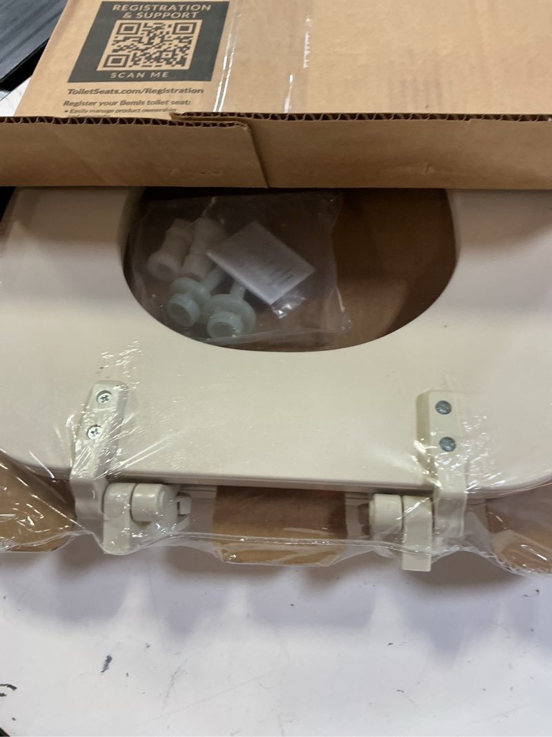 Condition photo showing New/Like New for mayfair padded toilet seat, cushioned soft vinyl over wood core seat, secure hinges, easy clean, made in usa, elongated, bone round bone toilet seat