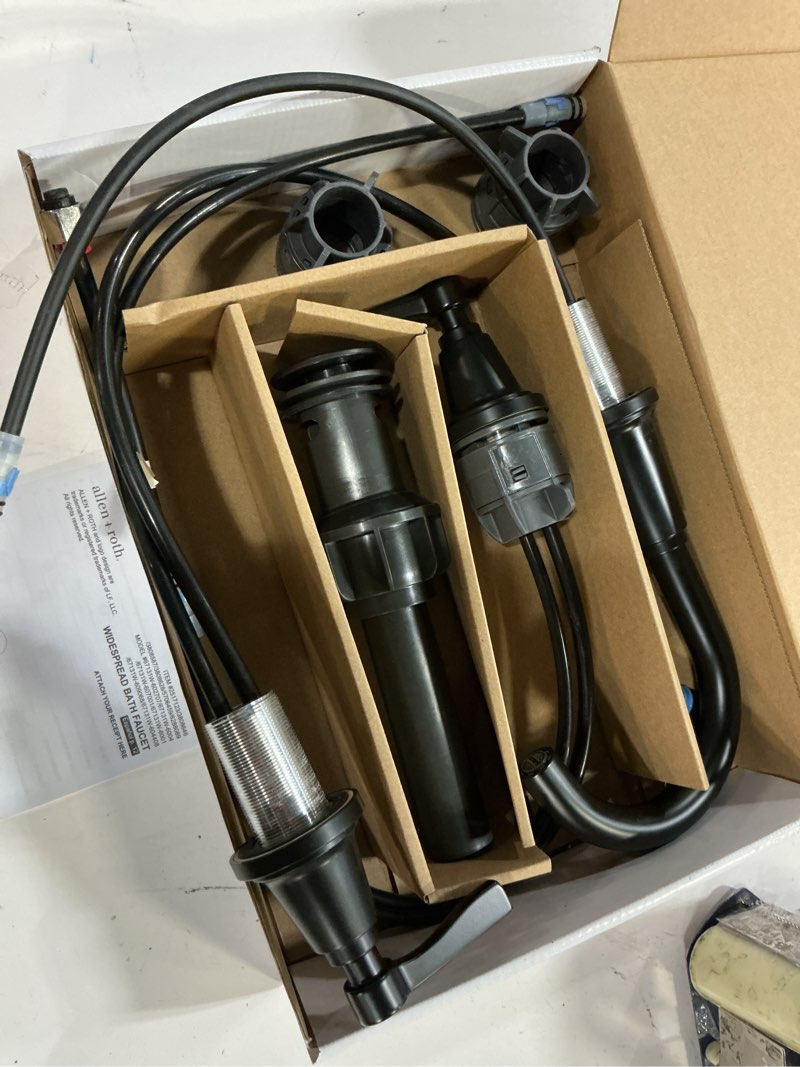 Condition photo showing As Is for delta woodhurst 1.2 gpm widespread bathroom faucet with pop-up drain assembly
