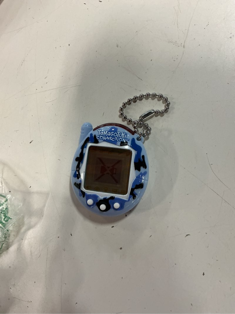 Condition photo showing As Is for tamagotchi connection - wild blue