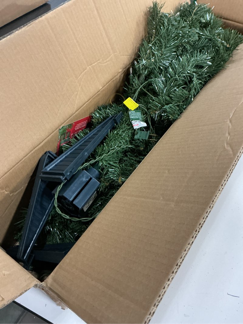 Condition photo showing As Is for national tree company 4 ft pre-lit grande canadian fir mini artificial christmas tree, 100 clear lights, 230 tips, includes stand, green 4ft 100 clear lights