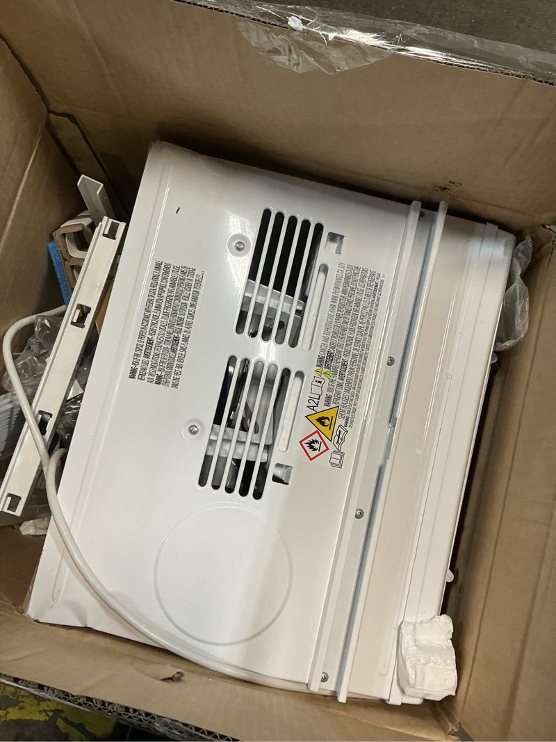 Condition photo showing As Is for amazon basics 6000-btu window air conditioner with quiet operation, up to 250 sqf, cool and fan functions, washable filter, adjustable window kit, digital temperature display, remote control, white