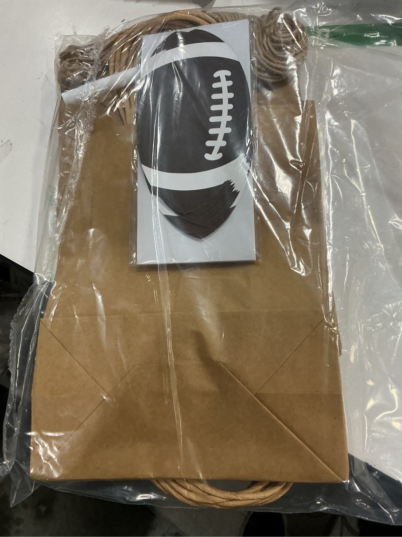 Condition photo showing Good Condition for Dansydaisy 12 Sets 10.6 Inch DIY Football Paper Gift Bag Sets with Handles Personalized Football Party Favor Bags Include Tags Stickers Marker Jute Rope Paper Goodie Bundle for Sport Party Supplies Brown Football