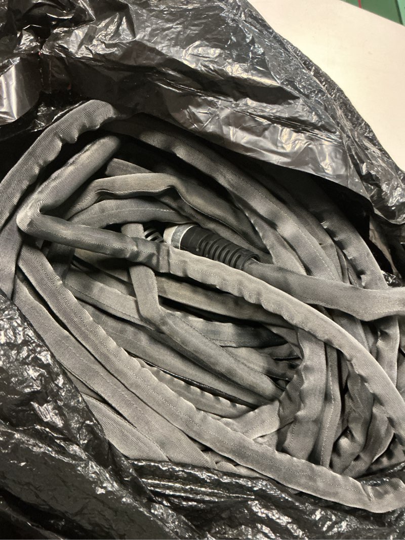 Condition photo showing As Is for zero-g teknor apex 5/8-in x 100-ft premium -duty kink free woven gray hose