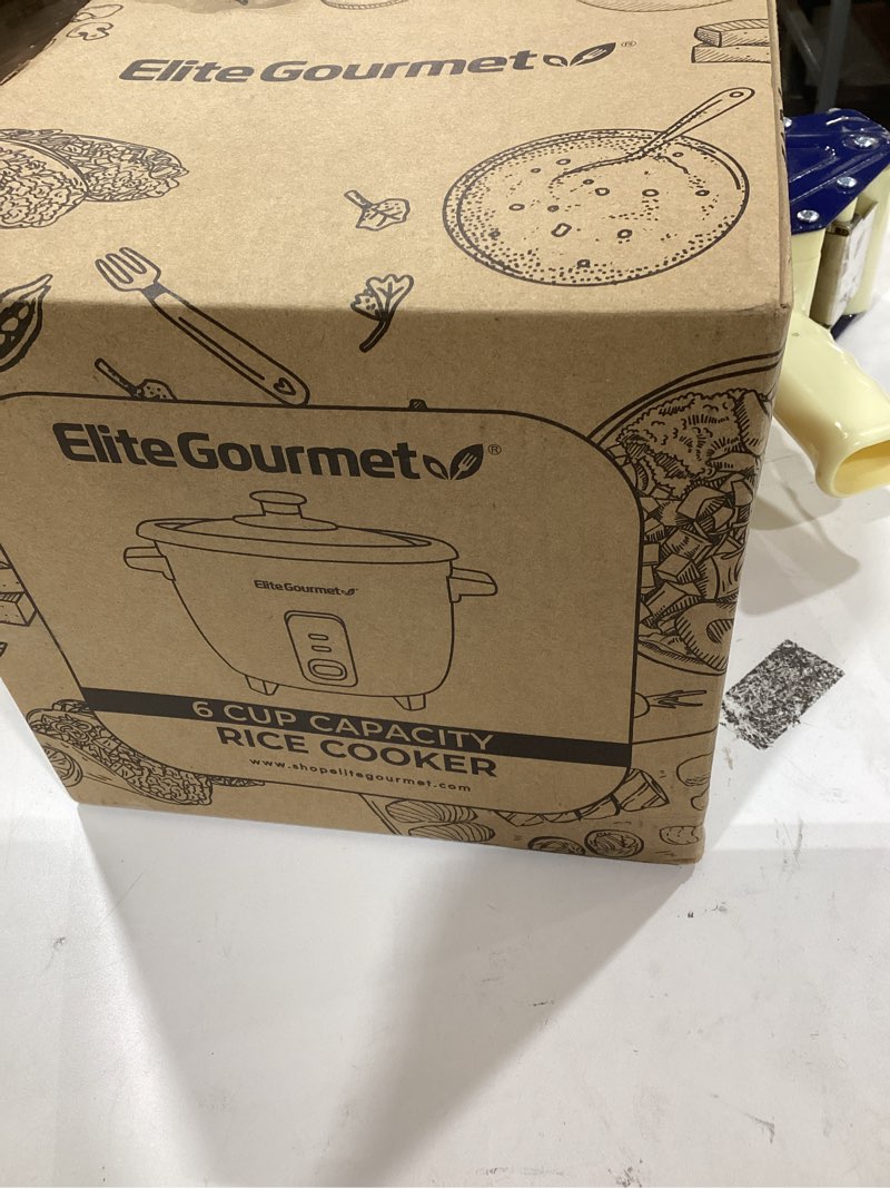 Condition photo showing Good Condition for Elite Gourmet ERC006SS 6-Cup Electric Rice Cooker with Stainless Steel Inner Pot, Makes Soups, Stews, Porridges, Grains and Cereals, 6 cup (3 cups uncooked), Black 6 Cups Cooked, Stainless Steel Black