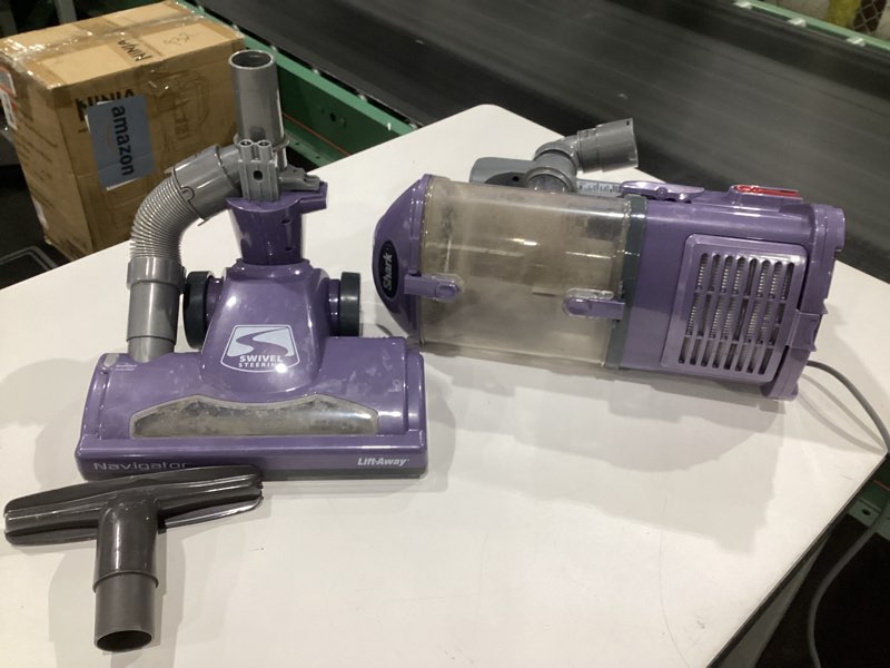 Condition photo showing As Is for (USED, NOT TESTED) Shark NV352 Navigator Lift Away Upright Vacuum, Hepa Filter, Anti-Allergen Technology, Swivel Steering, Ideal for Carpet, Stairs, & Bare Floors, with Wide Upholstery & Crevice Tools, Lavender Navigator (Lavender)