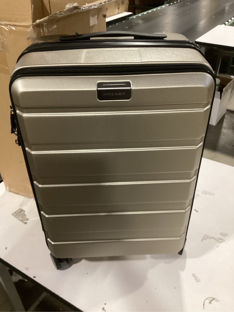 Condition photo showing New/Like New for KROSER Carry On Luggage with Spinner Wheels & Built-in TSA Lock, Expandable Top Opening Hard Shell Suitcase Large Capacity Durable Rolling Luggage with USB Port, Carry-On 20-Inch, Champagne