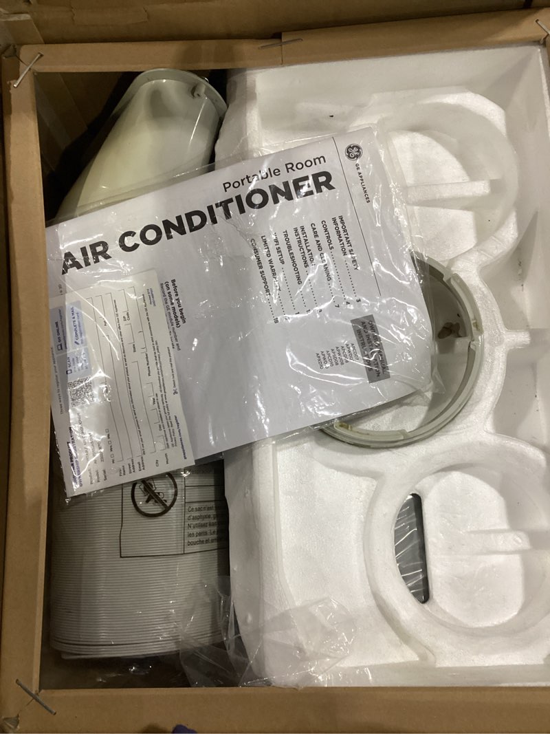 Condition photo showing As Is for ge 10,500 btu smart portable air conditioner for medium rooms up to 450 sq ft., 3-in-1 with dehumidify,fan and auto evaporation,dual hose compatible,included window installation kit,built-in wifi,grey