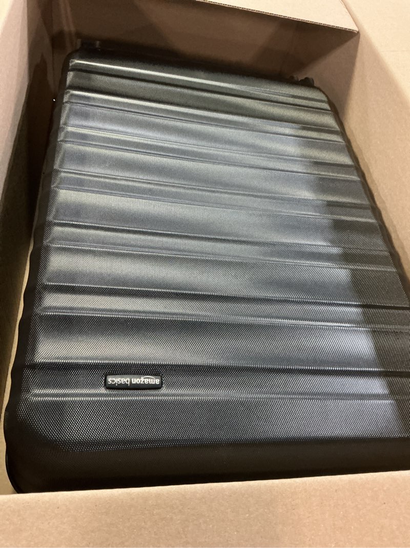 Condition photo showing Good Condition for amazon basics 30" hardside large checked luggage, hardshell suitcase with wheels, expandable for up to 15% more space, with scratch-resistant surface, four multi-directional wheels, black black large checked