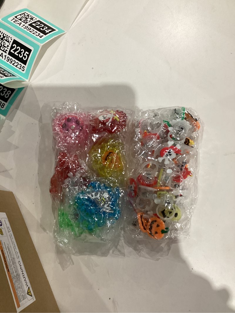 Condition photo showing New/Like New for 84 PCS Halloween Party Favors for Kids Halloween Glow In The Dark Toys Bulk Party Supplies Light Up Rotating Necklace LED Rings Halloween Goodie Bag Fillers Treats Classroom Prizes Trick or Treat Toys Style 2