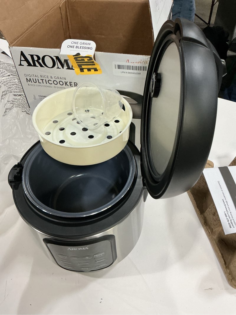 Condition photo showing As Is for aroma digital rice cooker, 4-cup (uncooked) / 8-cup (cooked), steamer, multicooker, slow cooker, oatmeal cooker, auto keep warm, 2 qt, stainless steel exterior