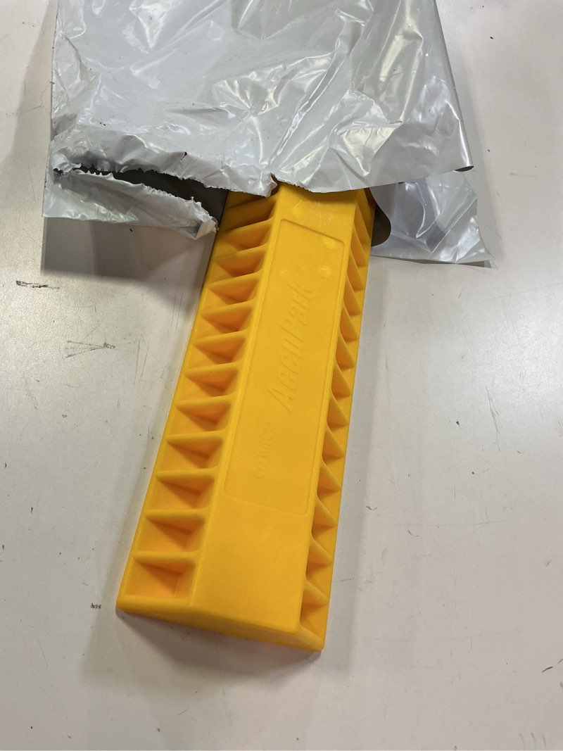 Condition photo showing Good Condition for camco accupark vehicle parking aid | features heavy duty high visible resin design | easy installation with adhesive strips | measures 18-3/8” x 3-3/4” x 1-1/3” | 1-pack (44442) one size parking aid 1-pk