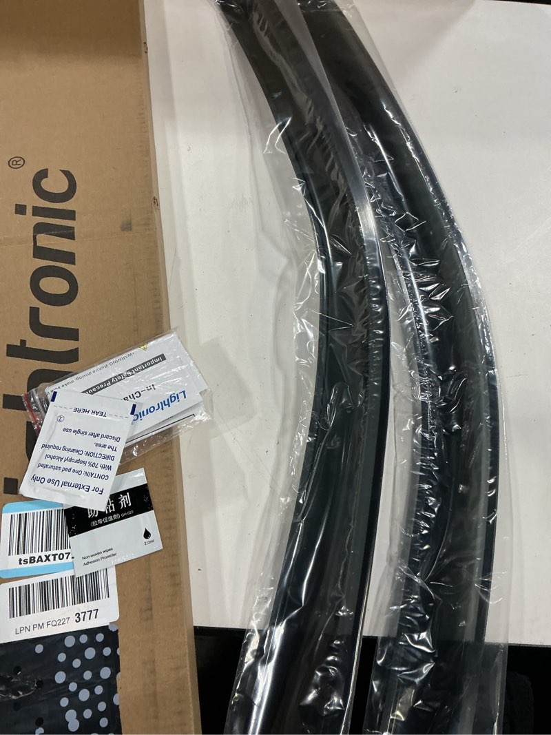 Condition photo showing New/Like New for lightronic extra durable clip-on in-channel auto vent window visor, fit 2009-2018 dodge ram 1500; 2010-2025 ram 2500 & 3500; 2019-2023 ram 1500 classic; regular cab, uv-protect rain guard, smoke, 2pcs