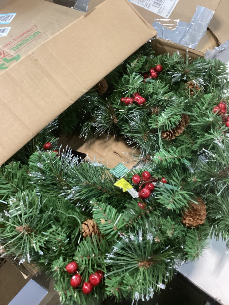 Condition photo showing Good Condition for National Tree Company 24 in Pre-Lit Crestwood Spruce Artificial Christmas Wreath, Christmas Decoration with Glitter, Pinecones, Red Berries, 50 Clear Lights, 160 Tips, Green 24 in Plug In Wreath