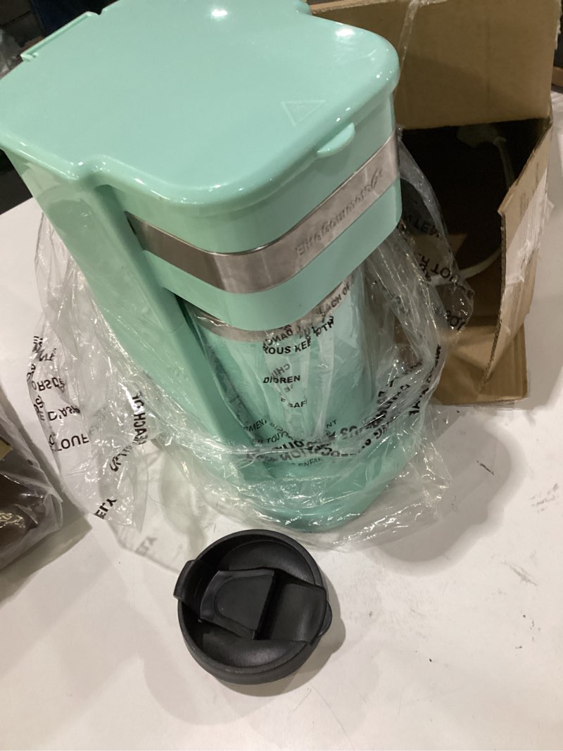 Condition photo showing As Is for elite gourmet ehc113m personal single-serve compact coffee maker brewer includes 14oz. stainless steel interior thermal travel mug, compatible with coffee grounds, reusable filter, mint mint 14 ounce