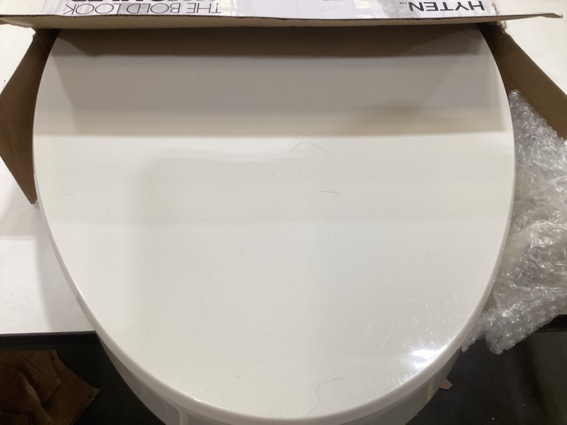 Condition photo showing As Is for kohler 25875-96 hyten 3" height, elevated soft close elongated toilet seat, contoured seat with grip-tight bumpers, quick-attach hardware, no slam toilet seat, biscuit biscuit elongated