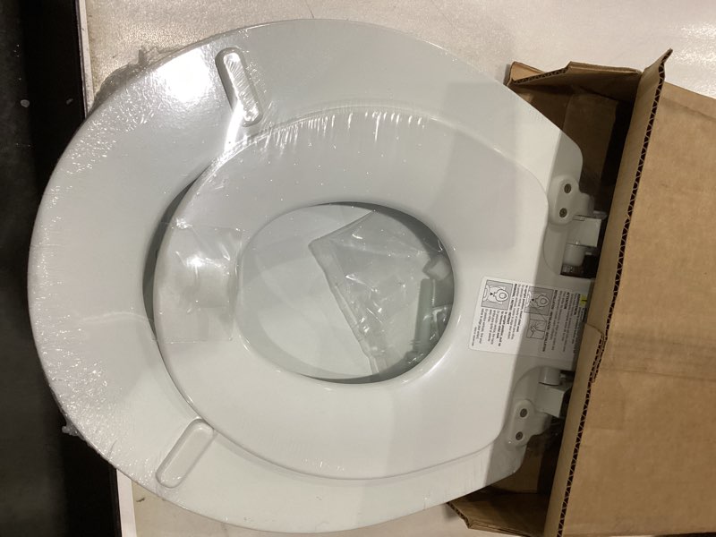 Condition photo showing As Is for Mayfair NextStep2 Slow-Close Toilet Seat with Built-In Toddler Potty Training Seat, Removable, White, Round Round 2-in-1 Toilet Seat