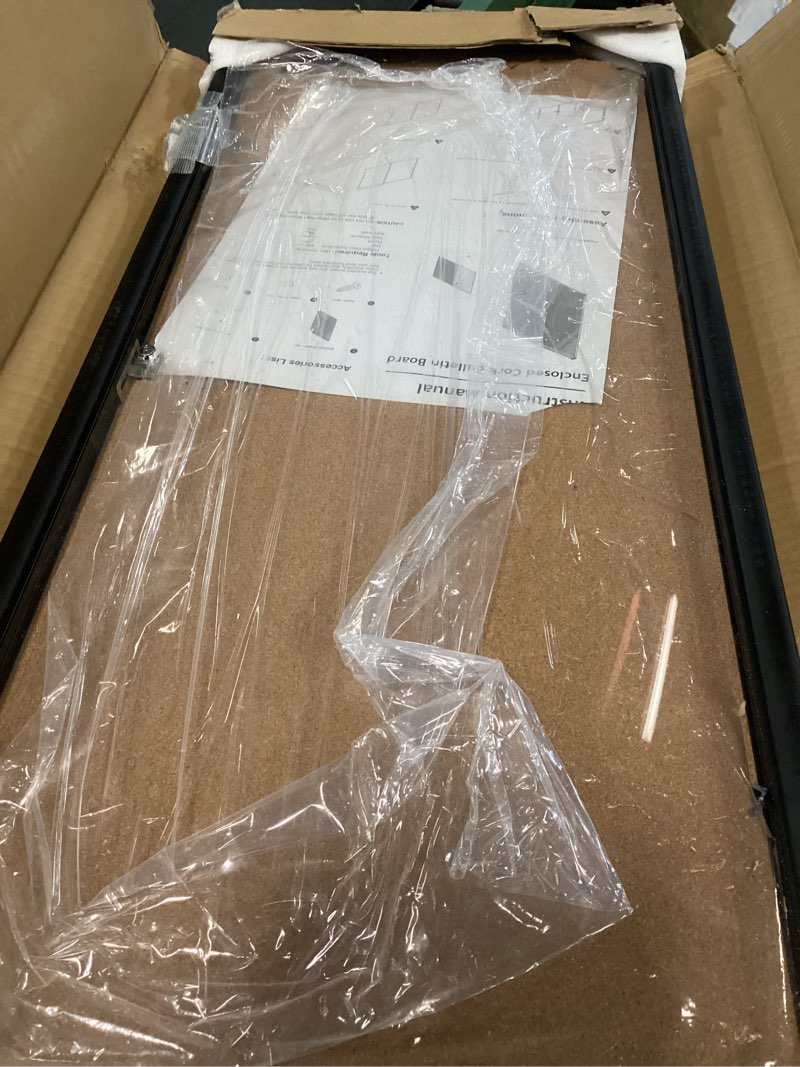 Condition photo showing As Is for innovart 38”x16” enclosed bulletin board, weatherproof outdoor enclosed cork board with swing-open locking door, black aluminum frame wall mounted display case for home, school, office, commercial 38"x16" black frame cork surface