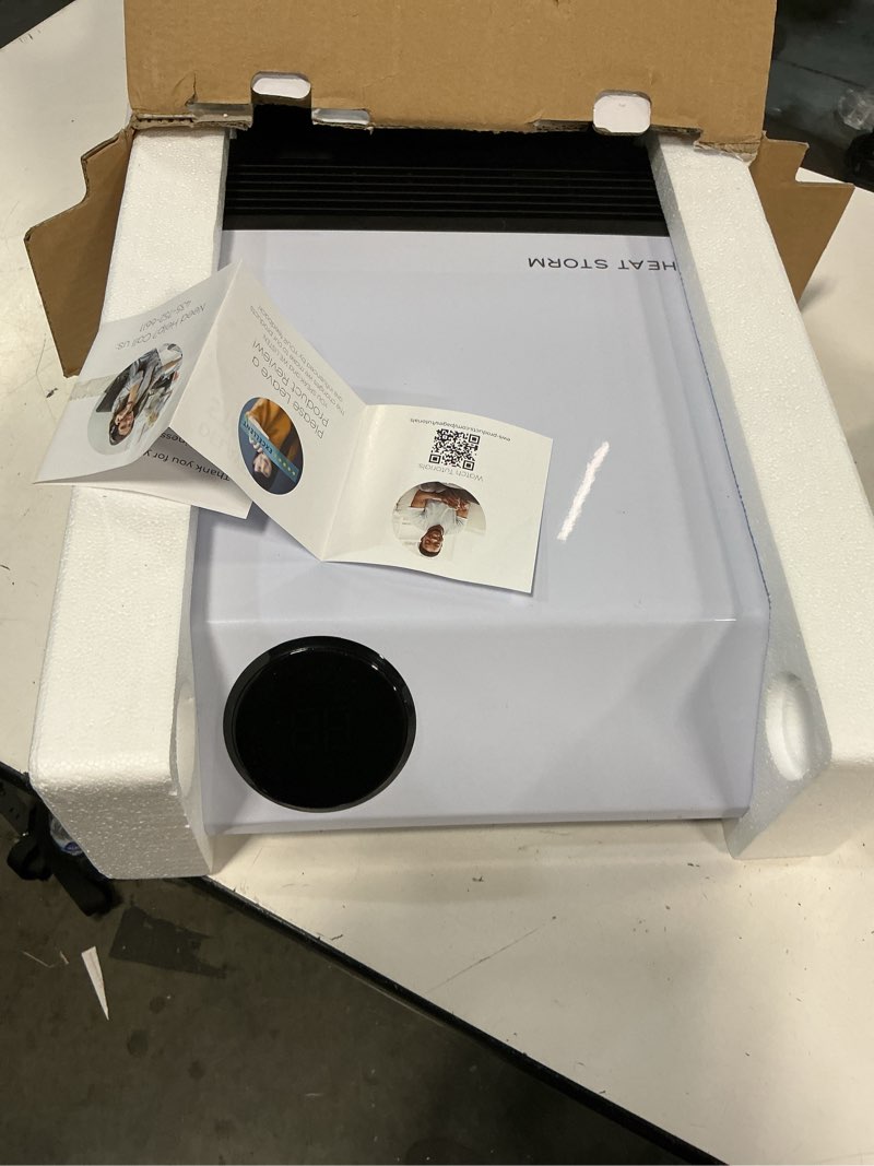 Condition photo showing As Is for heat storm wave floor to wall infrared space heater with attachable feet, remote control, built in thermostat, 500-1000 watts, 13x4x17 in, with feet