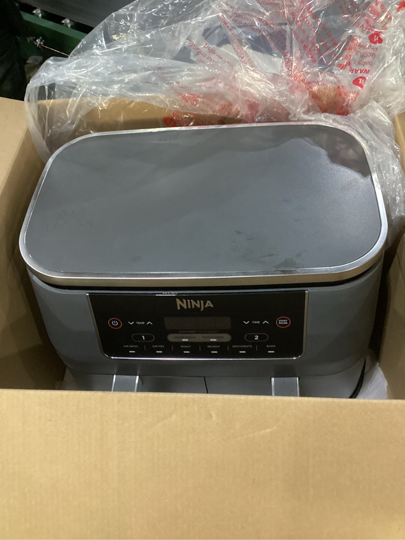 Condition photo showing New/Like New for Ninja DZ201 Foodi 8 Quart 6-in-1 DualZone 2-Basket Air Fryer with 2 Independent Frying Baskets, Match Cook & Smart Finish to Roast, Broil, Dehydrate & More for Quick, Easy Meals, Grey