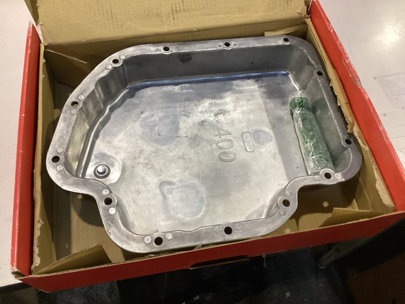 Condition photo showing As Is for **no gasket**racing power company r8492 polished aluminum finned transmission pan