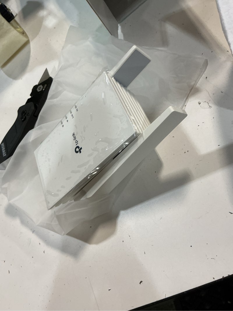 Condition photo showing New/Like New for tp-link ax1500 wi-fi 6 dual-band  range extender with quick 1.5 gbps transfer rate  smart roaming for steady wireless coverage and also connect a device through the ethernet port - re1500x